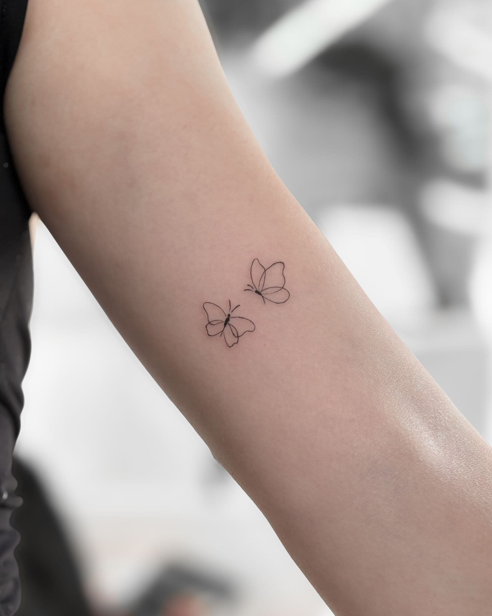 Schmetterlinge, Tattoo am Arm