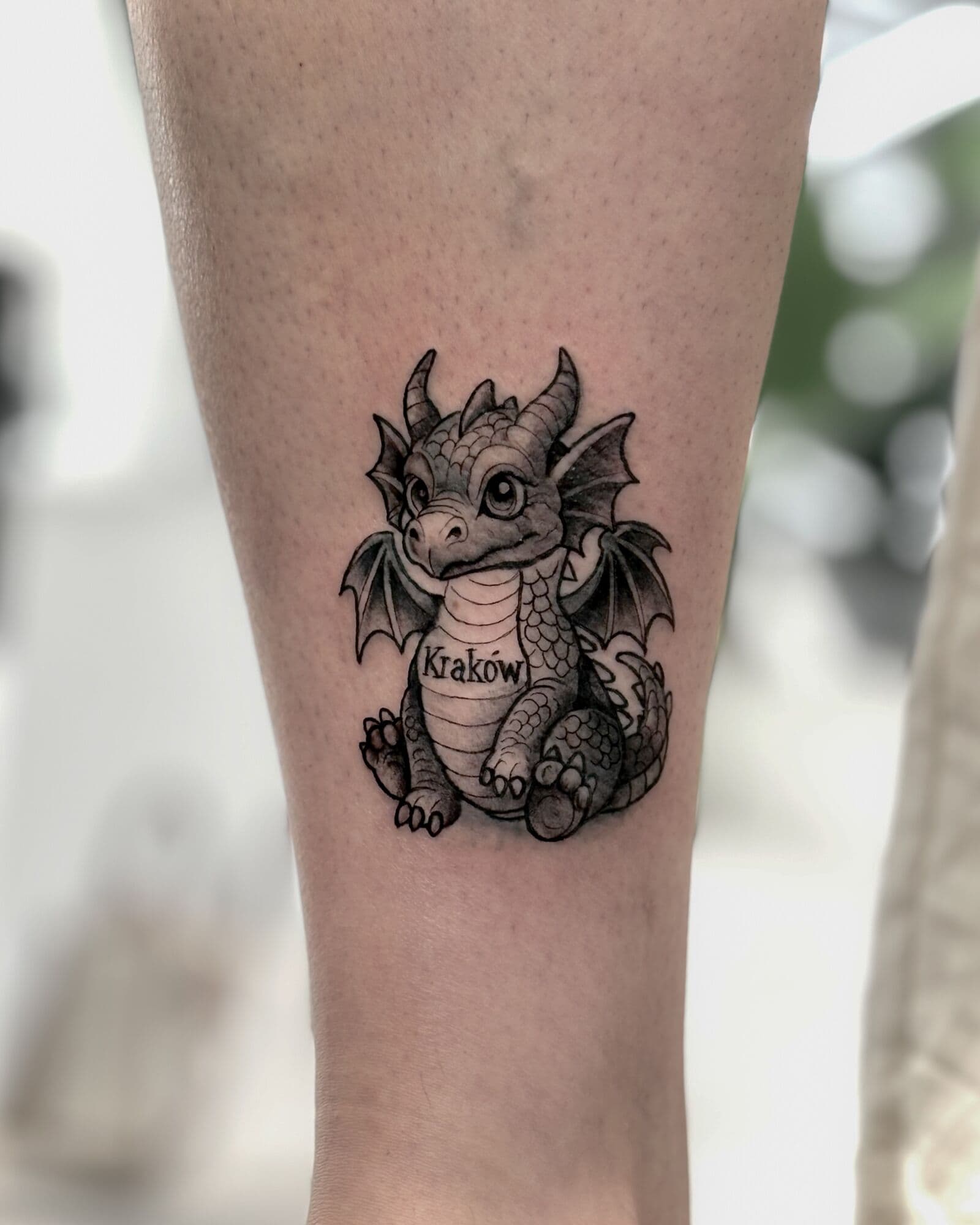 Baby-Drache, Tattoo am Unterarm